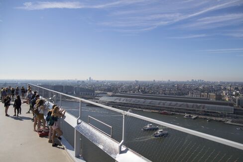 Sightseers take in the city skyline from a viewing platform of the A’DAM Toren