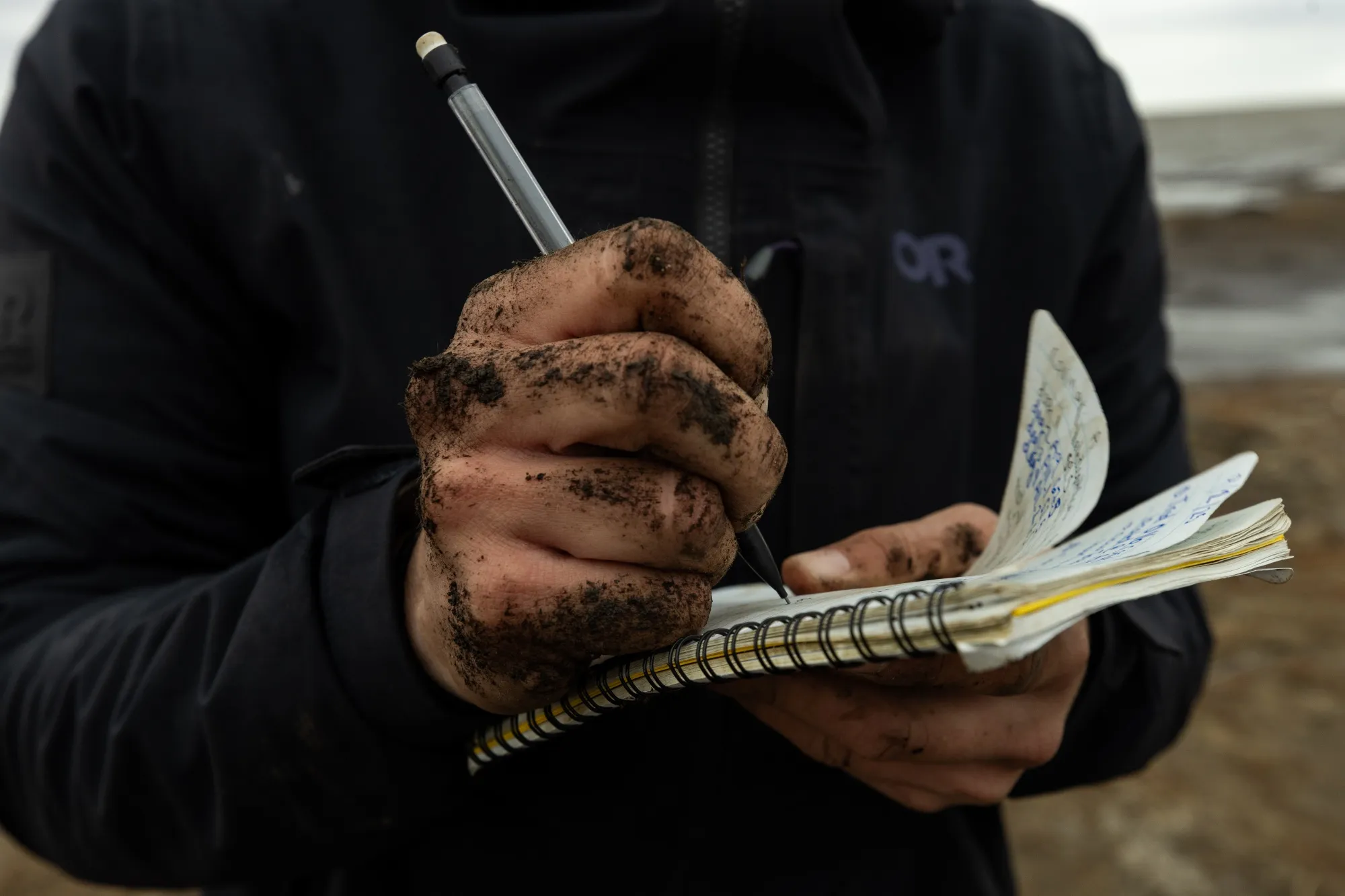 Hydrologist Alina Spera&nbsp;takes notes&nbsp;about soil samples.