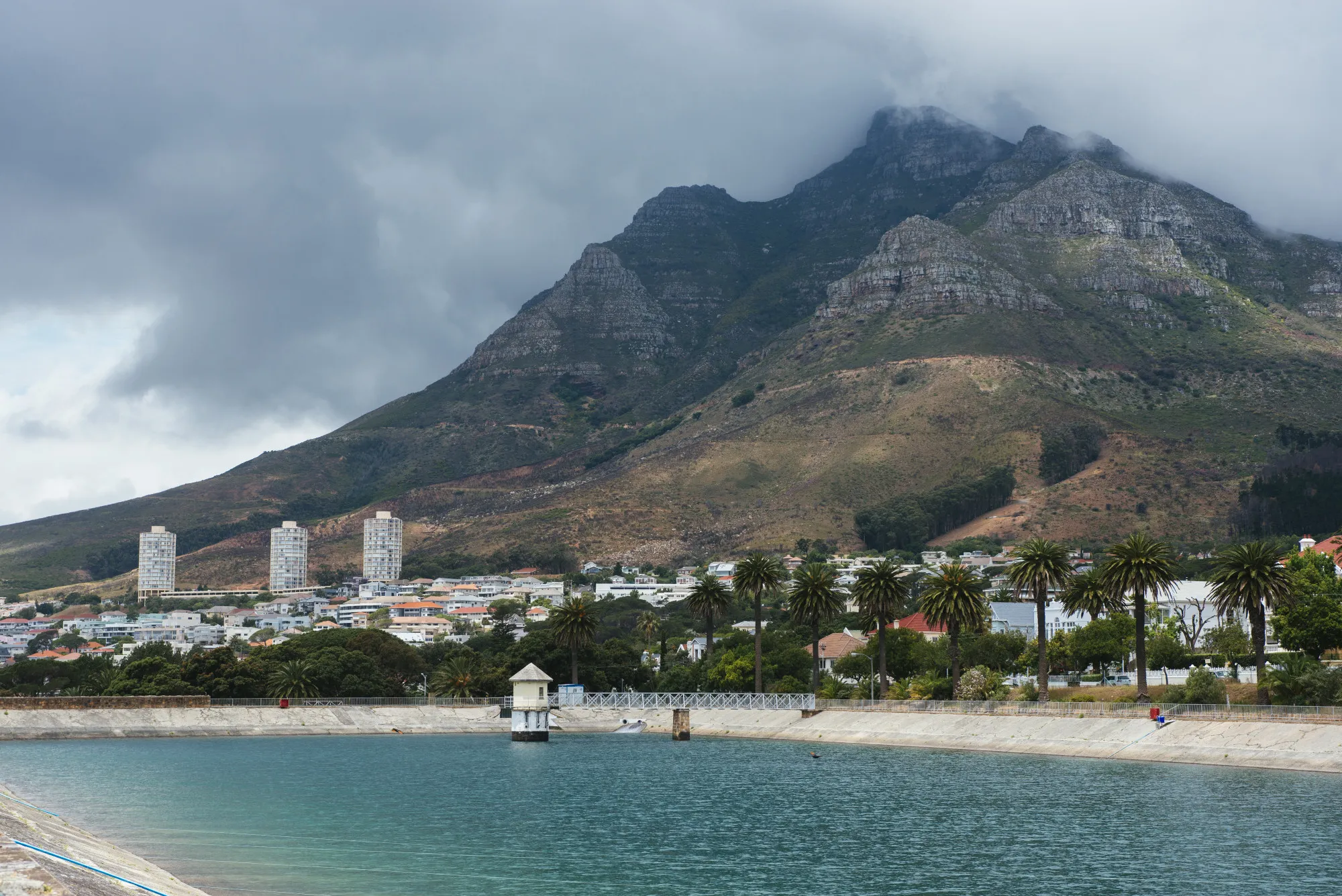 Property sits by the Molteno reservoir as Table mountain stands beyond in Cape Town.
