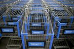 Shopping carts sit inside a Wal-Mart store in Alexandria, Virginia, U.S., on Wednesday, Nov. 14, 2012. Wal-Mart Stores Inc. is scheduled to release earnings data on Nov. 15.
