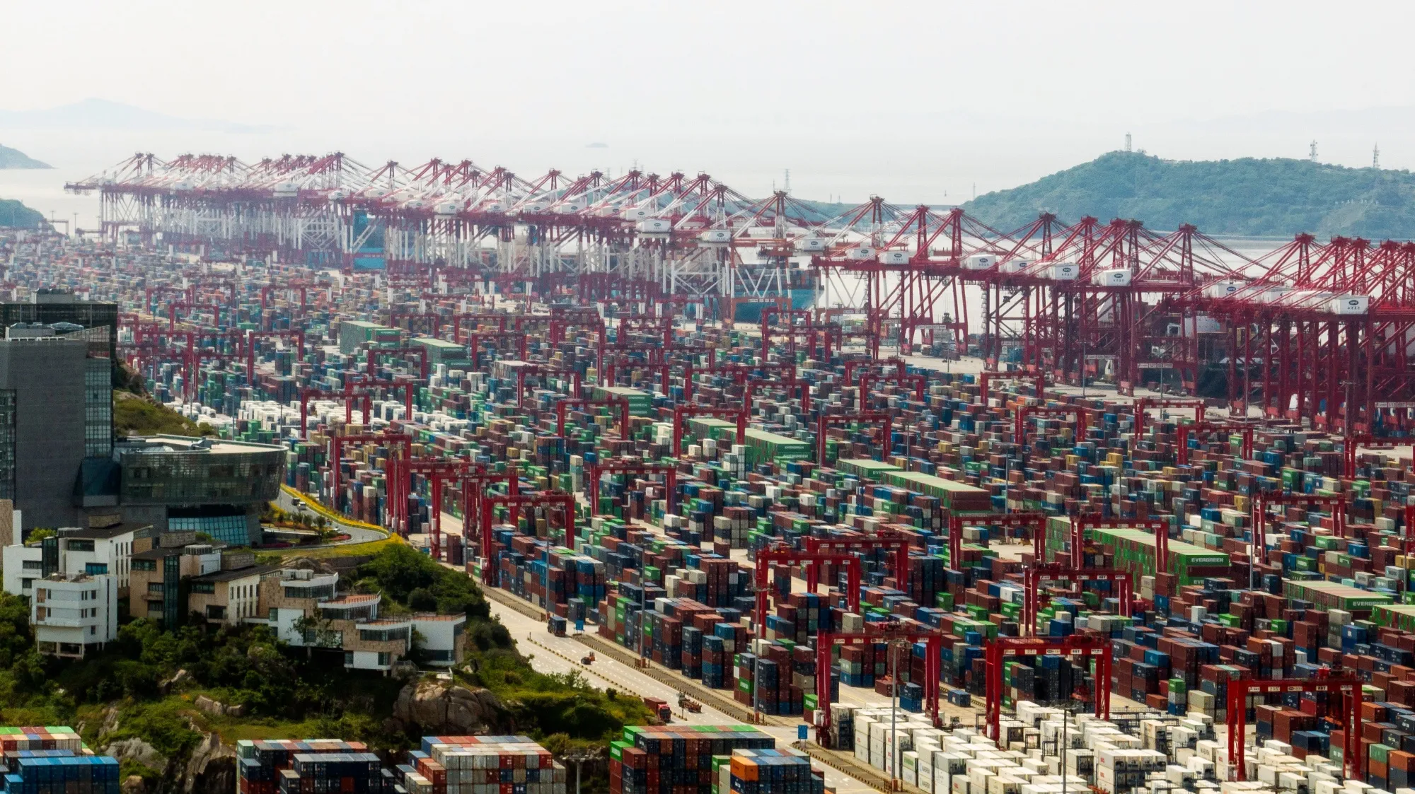 Gantry cranes and shipping containers at the Yangshan Deepwater Port in Shanghai, China.