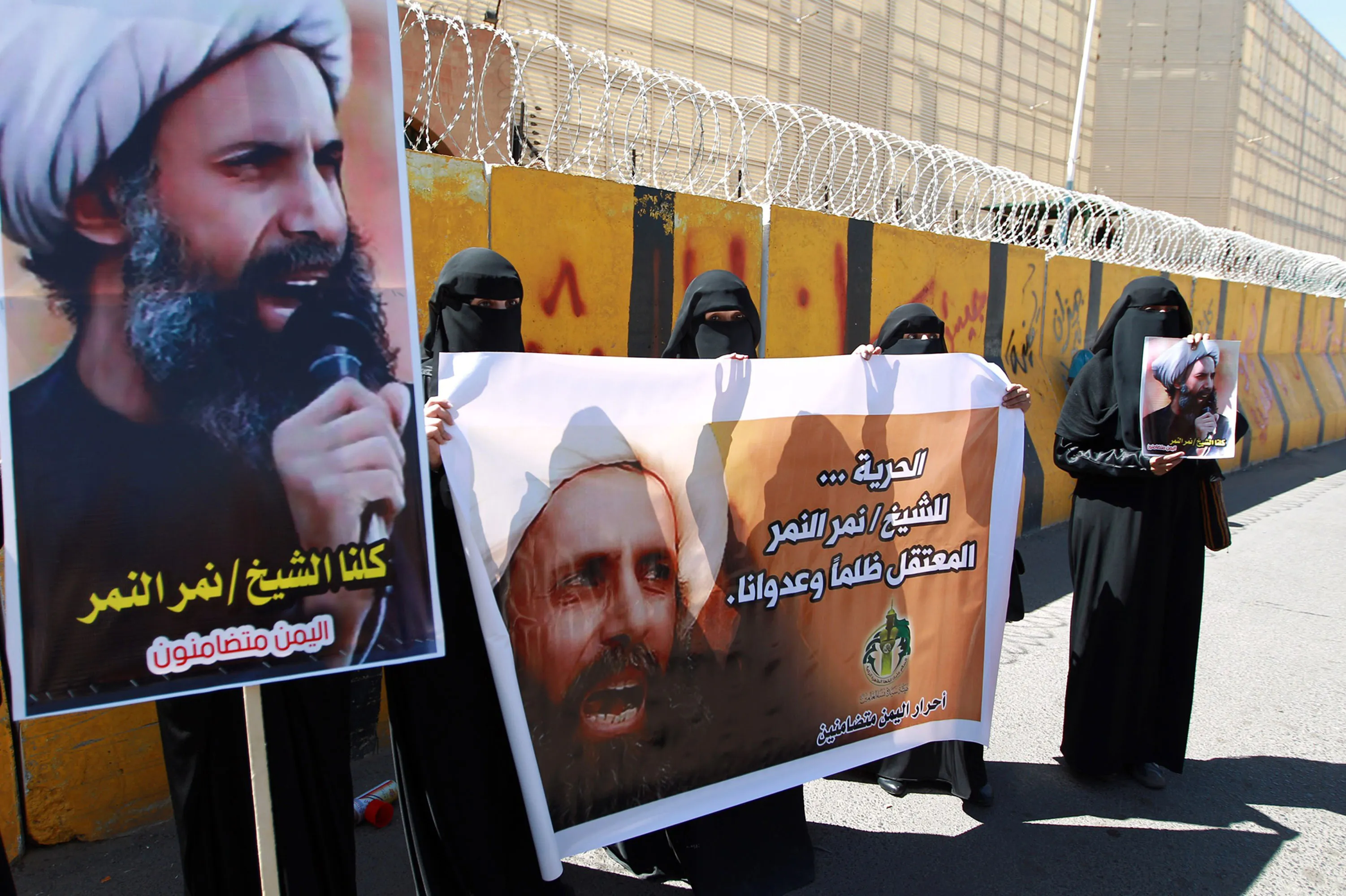 Yemeni protesters take part in a demonstration outside the Saudi embassy in Sanaa against the death sentence on Nimr al-Nimr in 2014.
