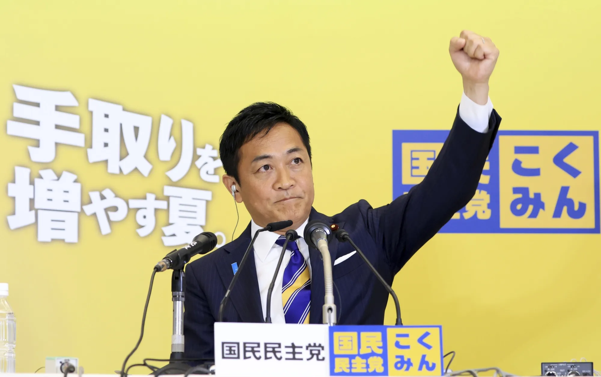 Democratic Party for the People leader Yuichiro Tamaki reacts to favorable upper house election results on July 20.