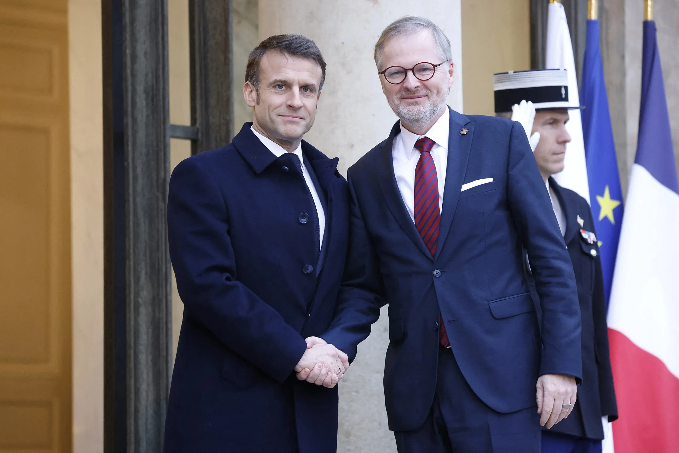 Emmanuel Macron greets Petr Fiala at the Elysee presidential palace in Paris on Feb. 26.