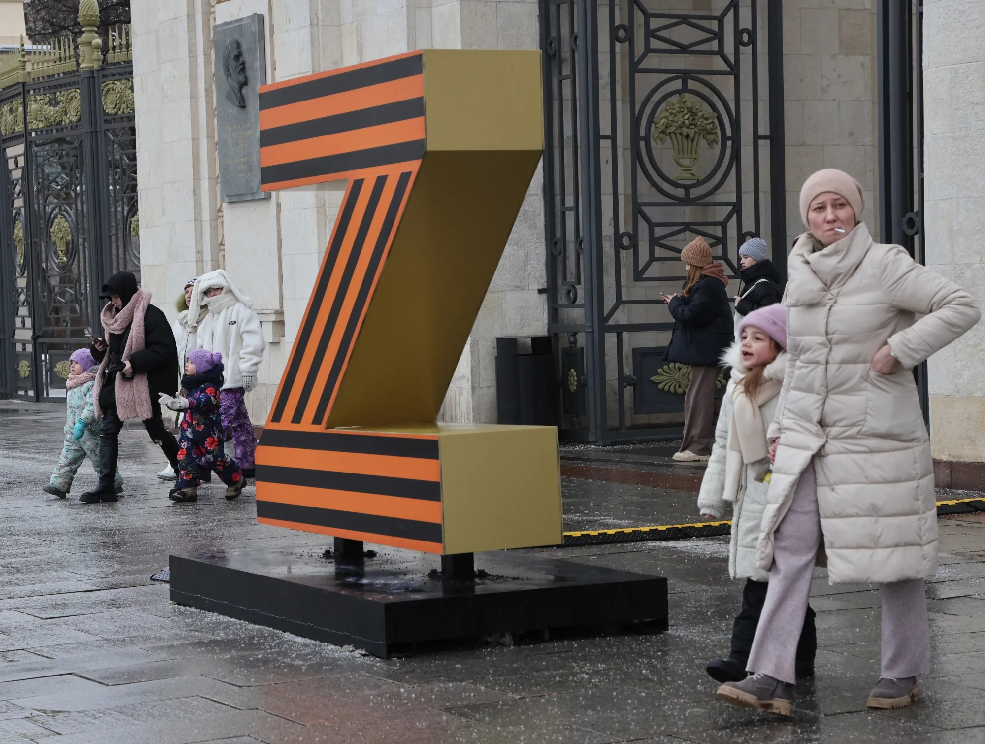 People walk past a giant letter Z&nbsp;installed by Moscow’s authorities as the symbol of support for the military invasion of Ukraine.