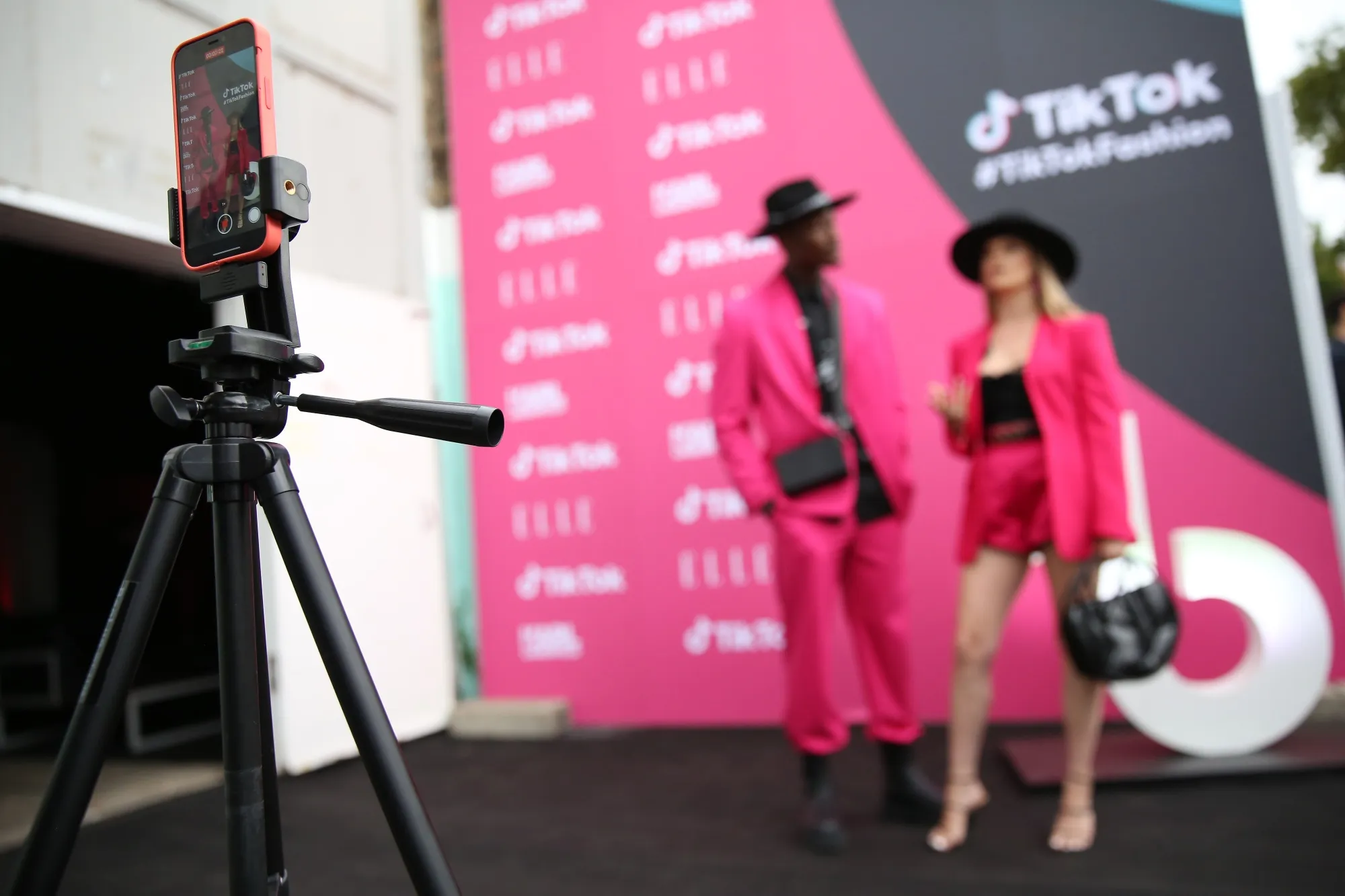 A mobile phone films participants walking along a red carpet as they attend TikTok’s ‘The Future of Fashion’ event in Berlin, Germany.&nbsp;
