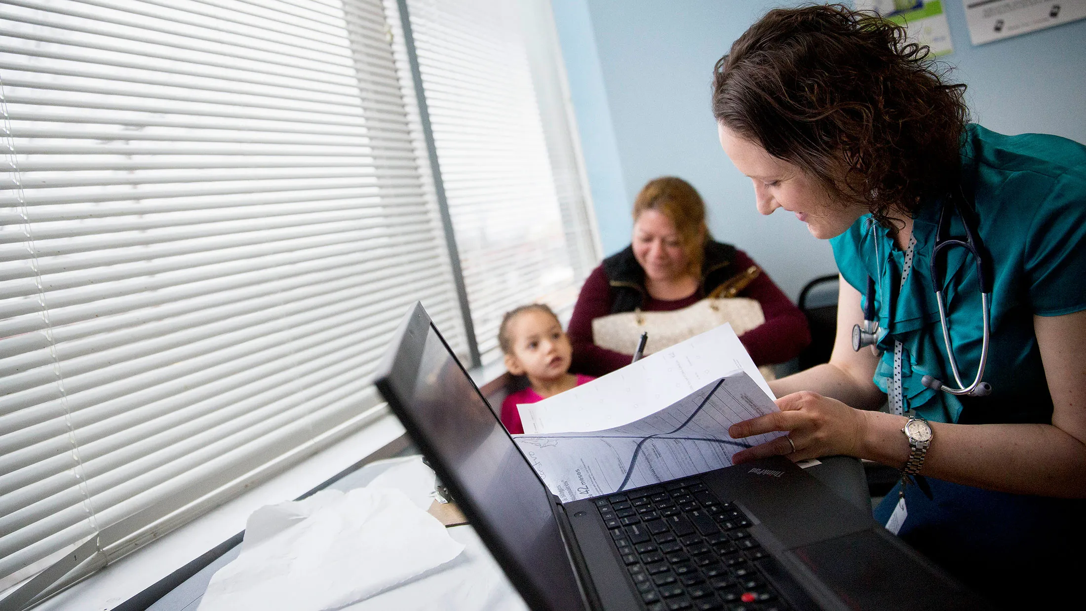 Pediatrician Helene Felman, right, meets with a patient and her mother at a Community Clinic Inc. health center in Takoma Park, Maryland, on April 8, 2015.
