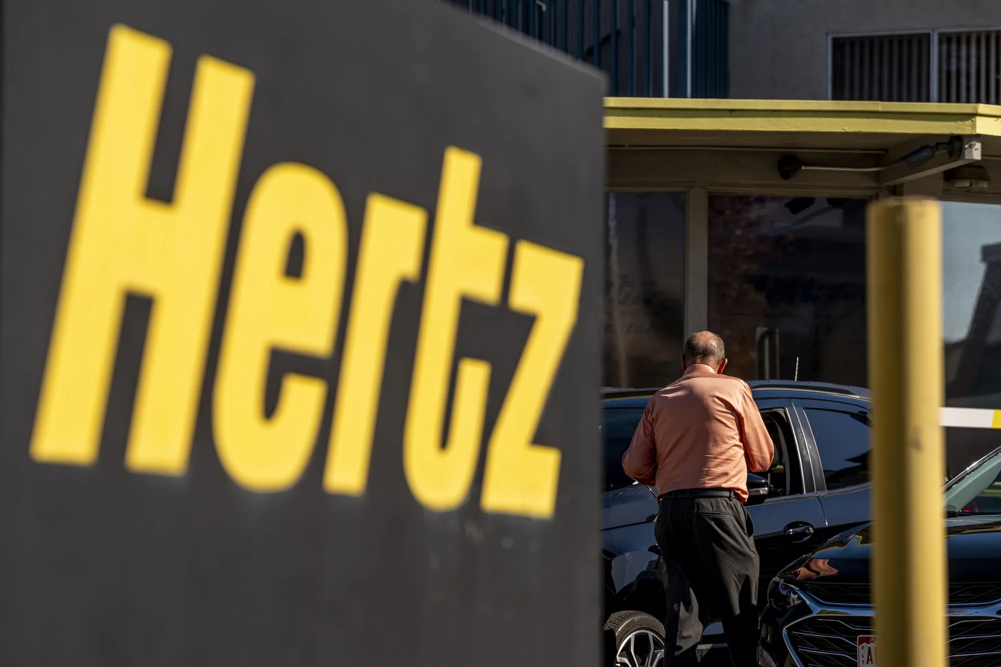 Signage at a Hertz car-rental lot in Berkeley, California.