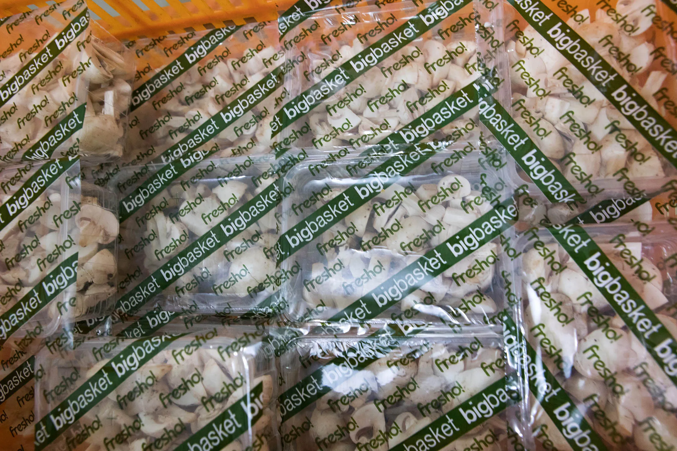 Packages of chopped mushrooms sit at a warehouse&nbsp;of Bigbasket, operated by Supermarket Grocery Supplies Pvt and owned by Innovative Retail Concepts Pvt, in Bengaluru, India, on Monday, Feb. 26, 2018. Bangalore-based Bigbasket delivers everyday cooking essentials like ghee (clarified butter), diced coconut and fragrant basmati rice, as well as 18,000 other items from bread to laundry detergent to eight million customers in 25 Indian cities.