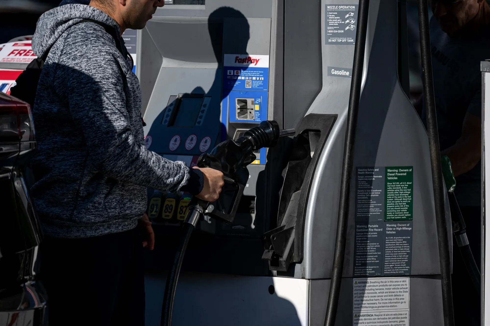 A driver refuels a vehicle at a&nbsp;gas station in San Francisco.