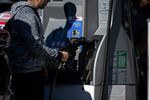 A driver refuels a vehicle at a Chevron gas station in San Francisco, California, US, on Wednesday, Nov. 26, 2025. AAA projects 81.8 million travelers will head 50 miles or more from home over the Thanksgiving holiday travel period.