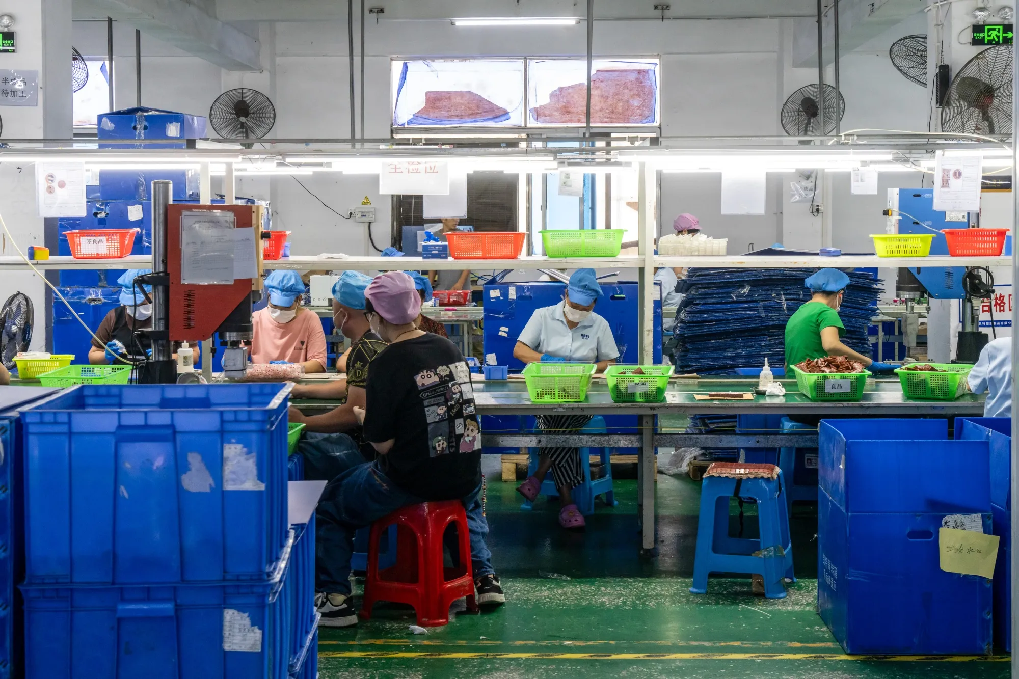 Workers on the production line at a&nbsp;plastic&nbsp;toy factory in Shenzhen, China.