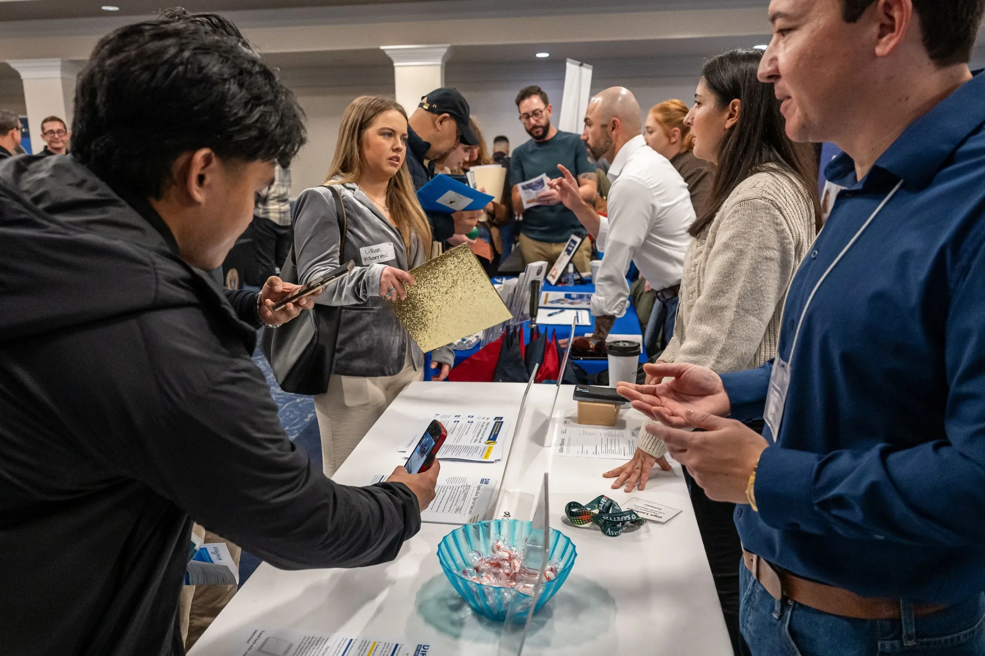 Job seekers speak with recruiters during a career job fair in Sacramento, California.