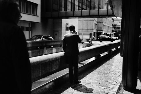 A banker makes a call in Zurich.