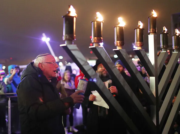 Bernie Sanders&nbsp;lights a Menorah during the Chanukah on Ice campaign event at Brenton Skating Plaza in Des Moines, Iowa, on Dec. 29.