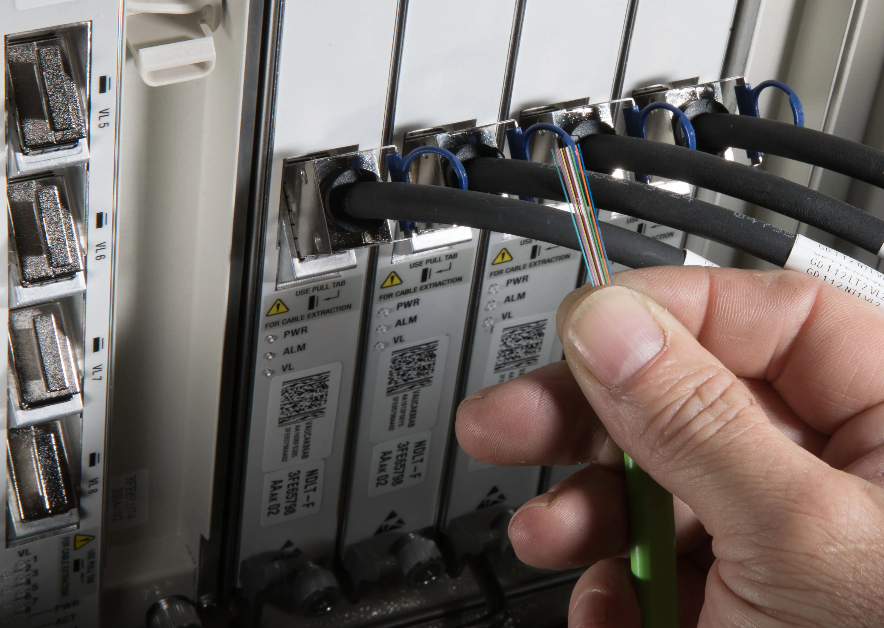 Strands of optical fiber in a cable.
