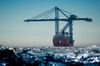 The Dockwise Swift heavy vessel transports Paceco Portainer STS gantry and Transtainer cranes to the Port of Long Beach in Long Beach, California, U.S., on Monday, Aug. 15, 2016. The port's decade-long, $4 billion capital improvement program to update terminals and other infrastructure is the biggest among all the U.S. ports.