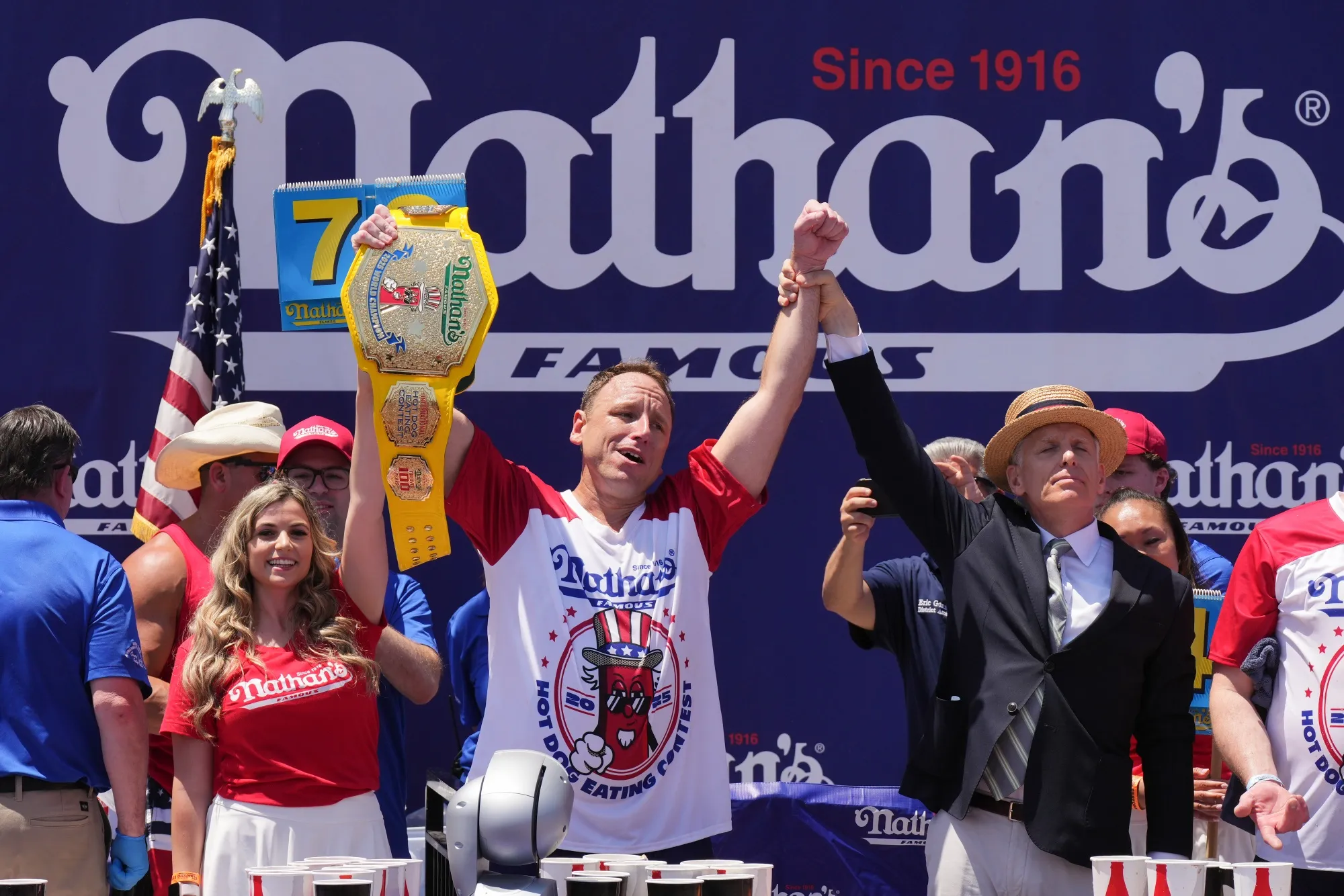 Joey Chestnut, center, after wining the men's division of&nbsp;Nathan's Annual Hot Dog Eating Contest on in New York on July 4.