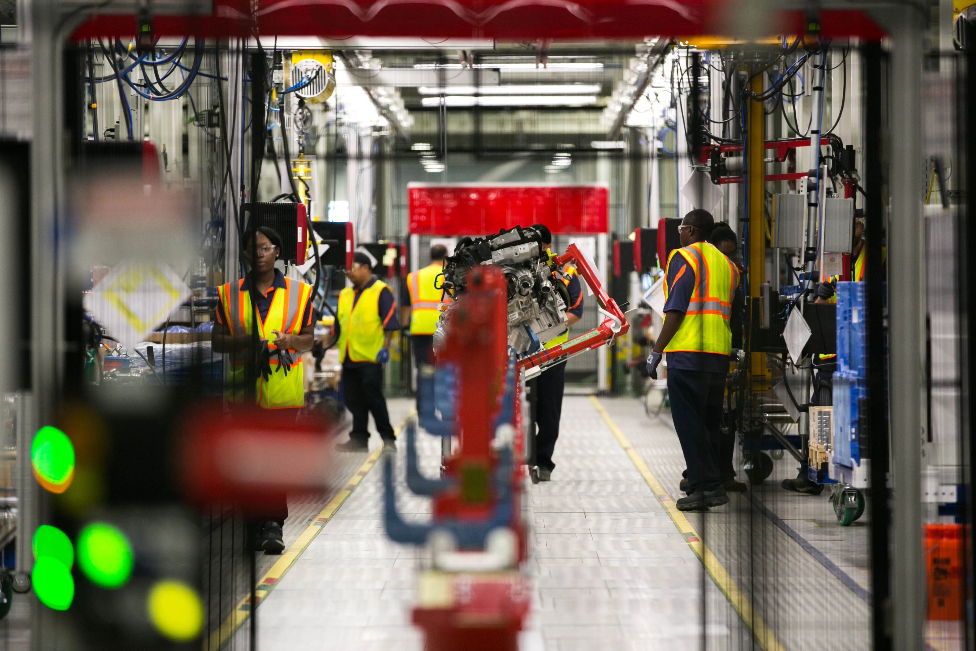 Workers assemble a motor during production of a Volvo AB S60 sedan at the Volvo Cars USA plant in Ridgeville, South Carolina,&nbsp;on&nbsp;June 20.&nbsp;