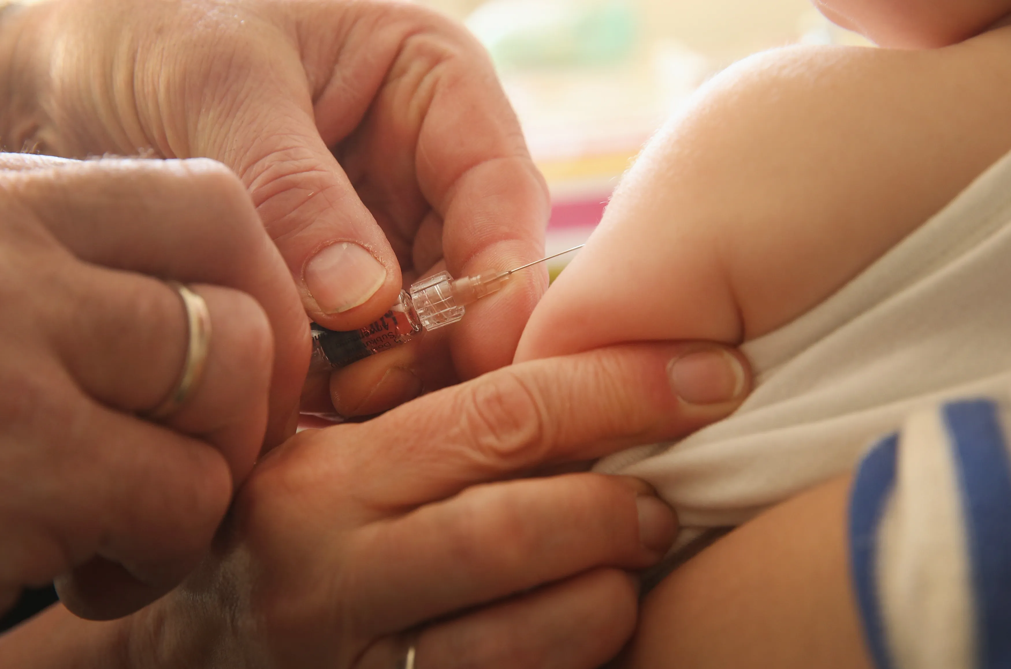A doctor injects a vaccine against measles, rubella, mumps and chicken pox to an infant&nbsp;in Berlin, Germany.&nbsp;