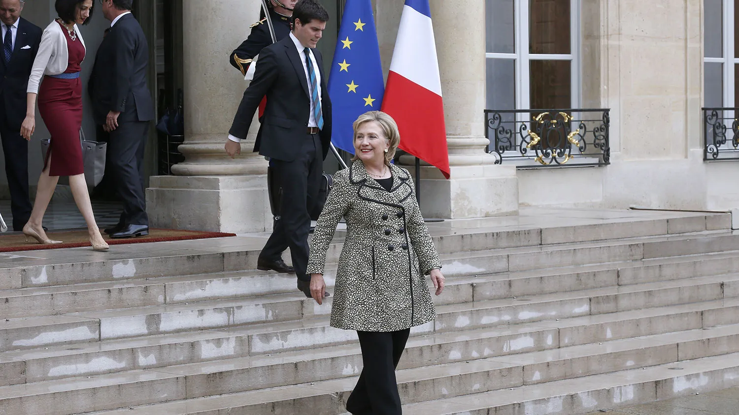 Former US Secretary of State and Senator Hillary Clinton (C) leaves the Elysee Palace in Paris on July 8, 2014, after meeting the French President.
