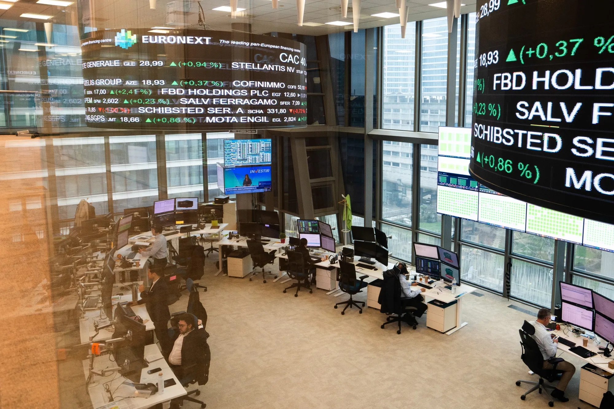 Trading data on digital boards at the Euronext NV stock exchange in the La Defense business district in Paris, France, on Thursday, Jan. 16, 2025. A heavy discount continues to plague French assets and Prime Minister Francois Bayrou’s attempt to tackle the ongoing political crisis has been far from enough to bring investors back.