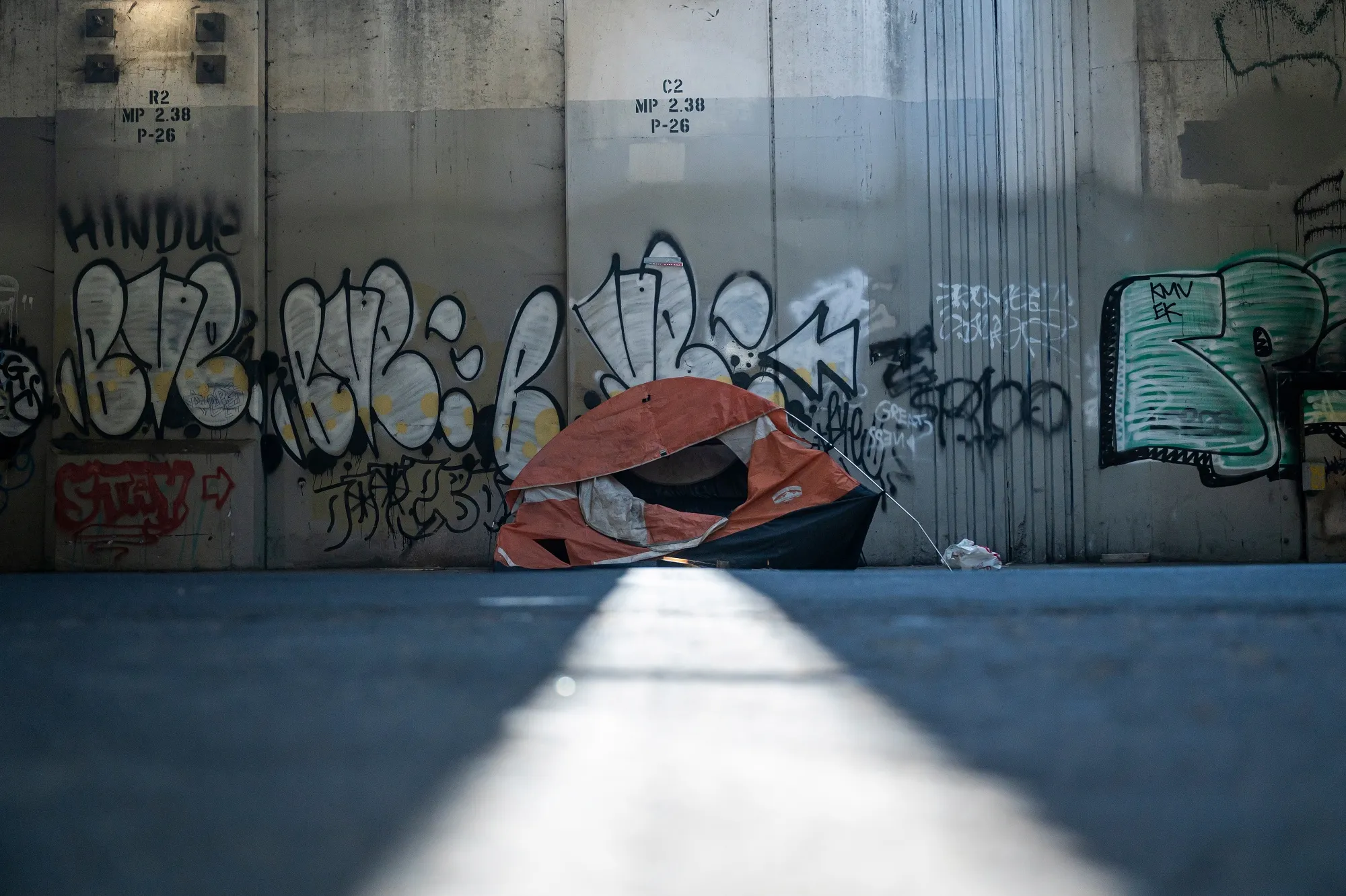 A tent underneath an overpass&nbsp;in Oakland, California, in April 2024.&nbsp;