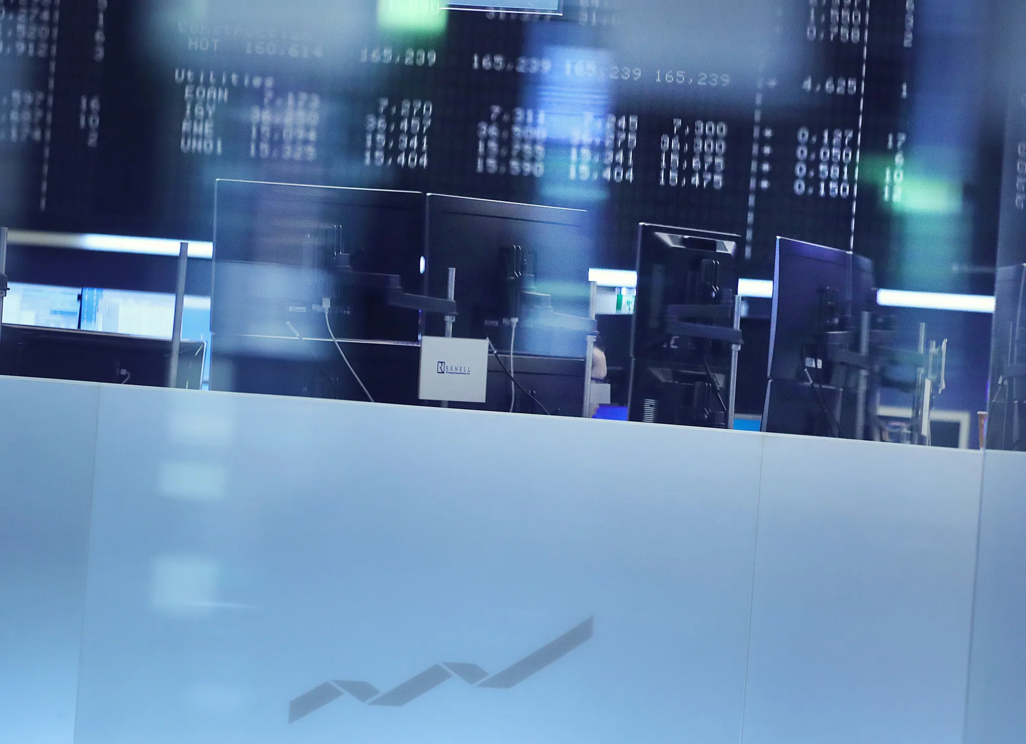 A DAX index curve logo sits on a glass panel inside the Frankfurt Stock Exchange in Frankfurt, Germany, on Monday, April 24, 2017. Franceâs bonds jumped, with the 10-year yield dropping to its lowest level in three months, after centrist Emmanuel Macron and nationalist Marine Le Pen won the first round of the nationâs presidential election.
