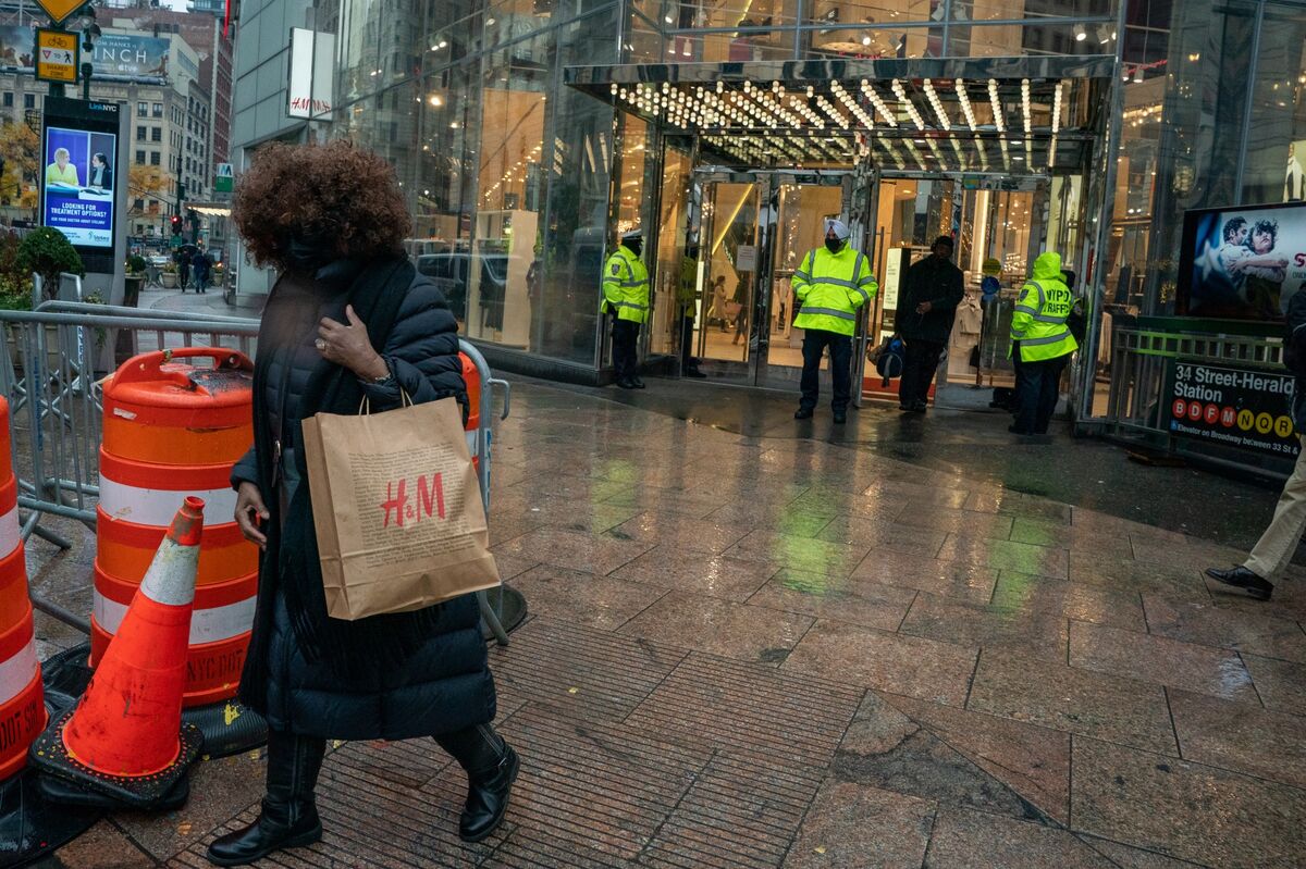 A shopper outside an H&M store  in the Herald Square area of New York, U.S.