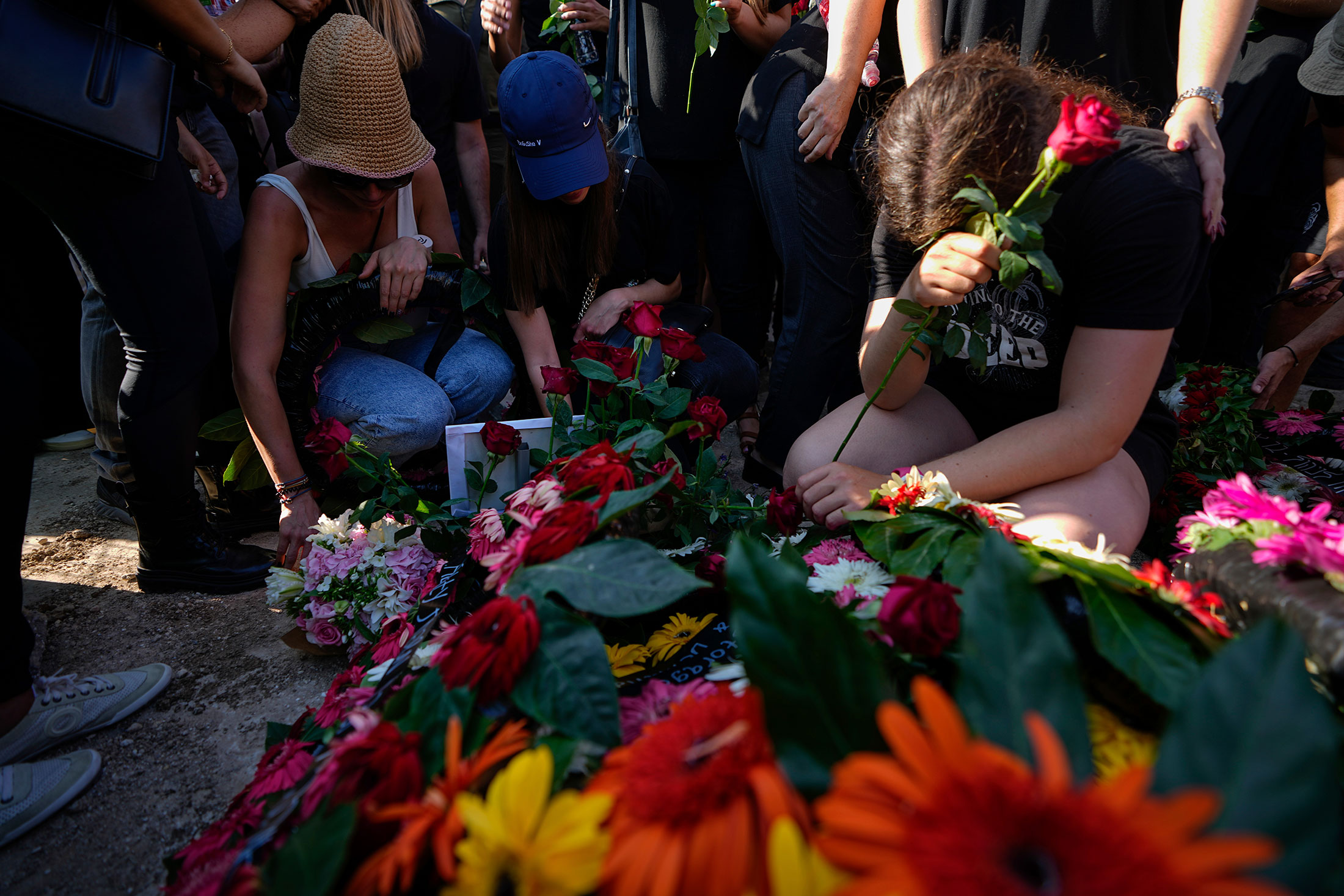Mourning Danielle and Noam. Photographer: Ariel Schalit/AP Photo