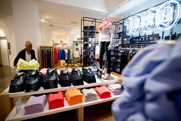 An employee folds clothes at a Gap store in San Francisco on Feb. 28, 2013