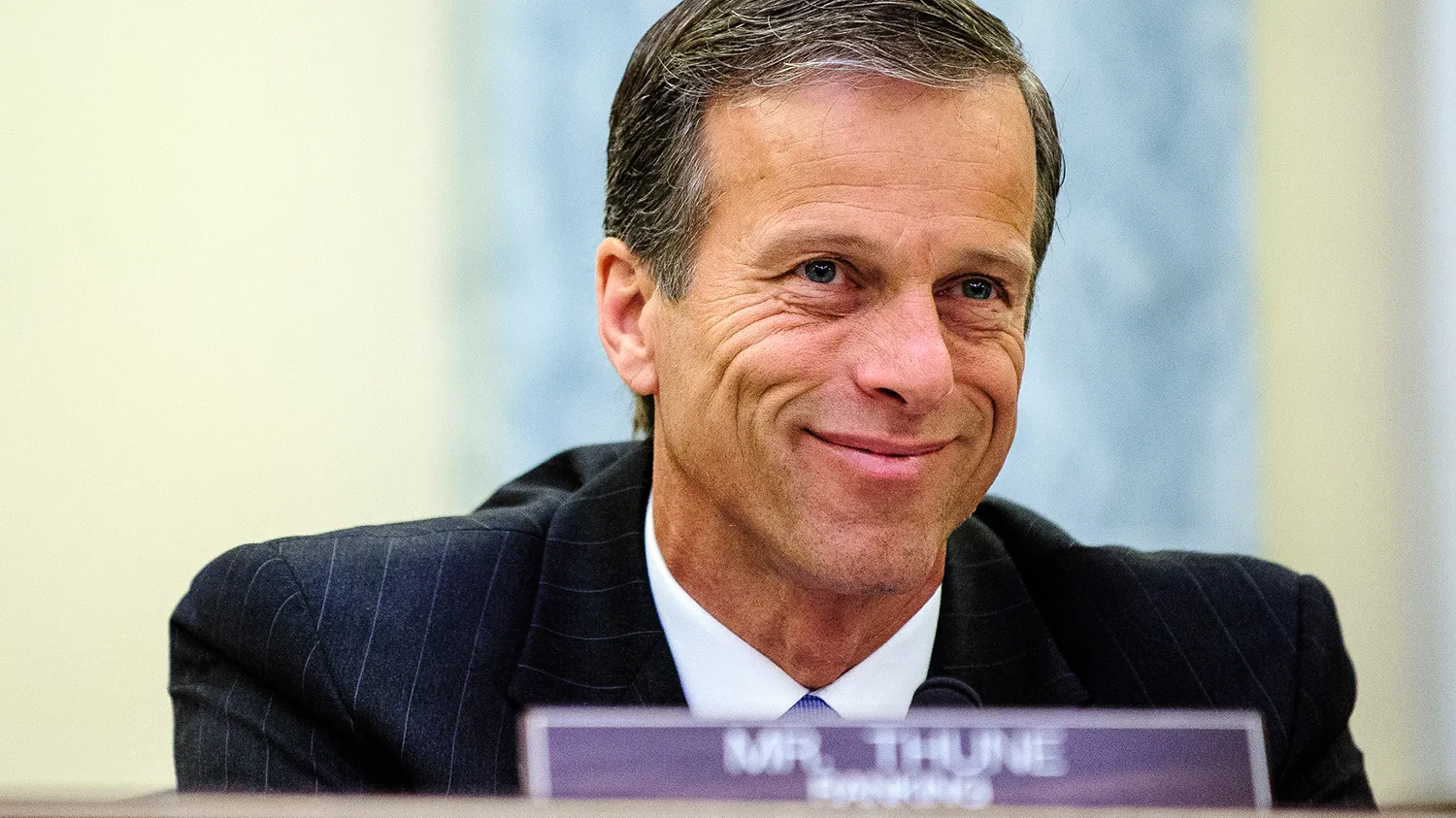 Senator John Thune, a Republican from South Dakota, smiles during a Senate Commerce, Science and Transportation Committee hearing on the nomination of Chicago billionaire Penny Pritzker for Commerce secretary in Washington, D.C., U.S., on Thursday, May 23, 2013.
