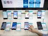 An employee demonstrates an Huawei Technologies Co. Honor 9 inside a Telenor Serbia mobile phone store, operated by Telenor ASA, in Belgrade, Serbia