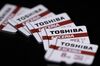 Toshiba Corp. Exceria micro secure digital high capacity (microSDHC) memory cards are arranged for a photograph in Tokyo, Japan, on Thursday, Aug. 17, 2017. Under pressure from its banks, Toshiba is racing to resolve several final disagreements with Western Digital Corp. before it can complete a deal to sell its chips business to the U.S. company and other investors by the end of August, according to people familiar with the matter.