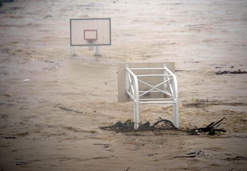 A basket stadium is flooded by the Jingmei river as typhoon Soudelor hits Taipei on August 8, 2015. Typhoon Soudelor battered Taiwan with fierce winds and rain leaving a trail of destruction in its wake.