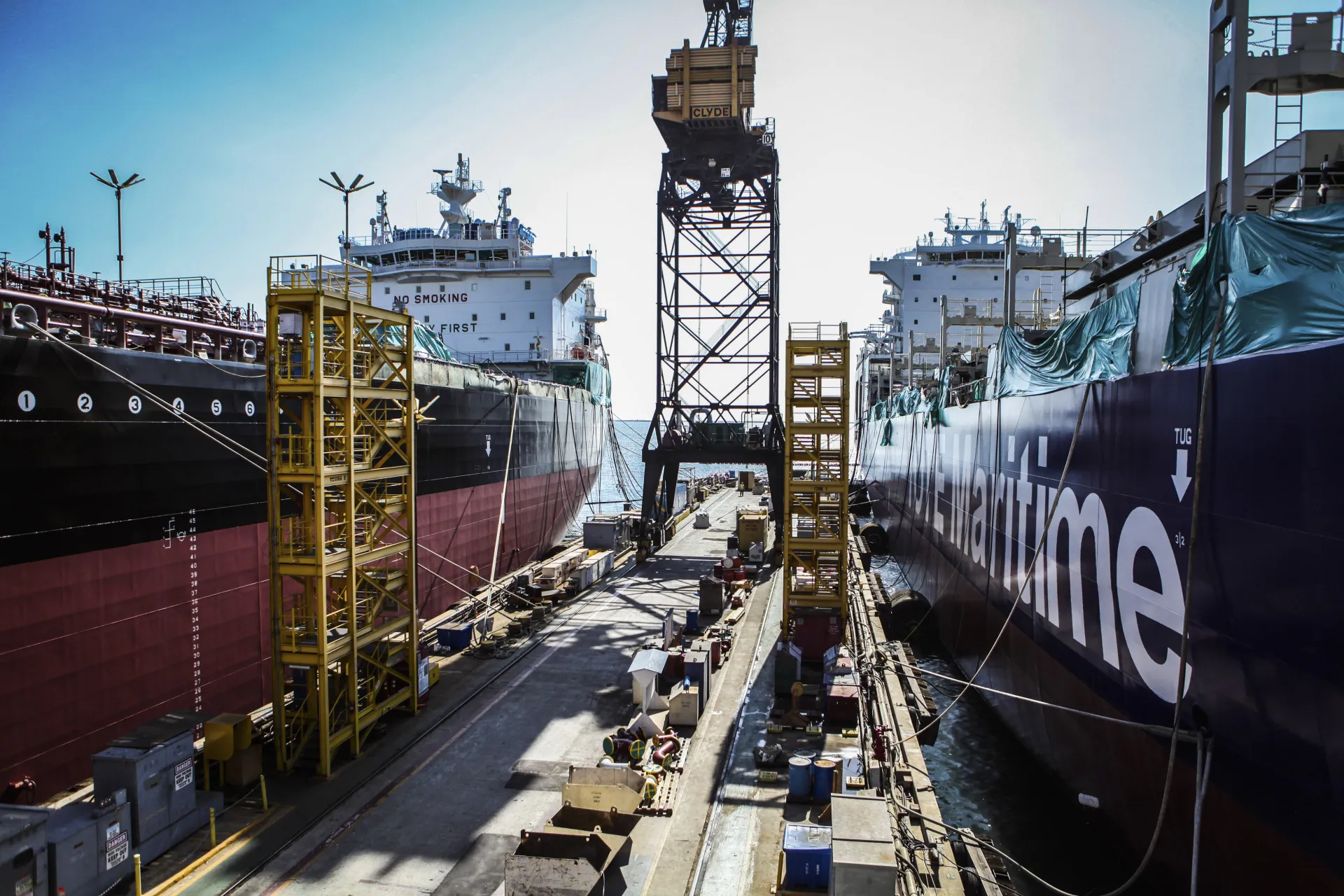 The American Petroleum Tankers' (APT) Lone Star State ship, left, and Tote Inc. ship sit docked while under construction at the General Dynamics NASSCO shipyard in San Diego, California, U.S., on Tuesday, Oct. 20, 2015. The Lone Star State is the first of a five-tanker contract between General Dynamics NASSCO, a wholly-owned subsidiary of General Dynamics Corp., and APT which calls for the design and construction of five liquefied natural gas (LNG) conversion-ready product carriers.
