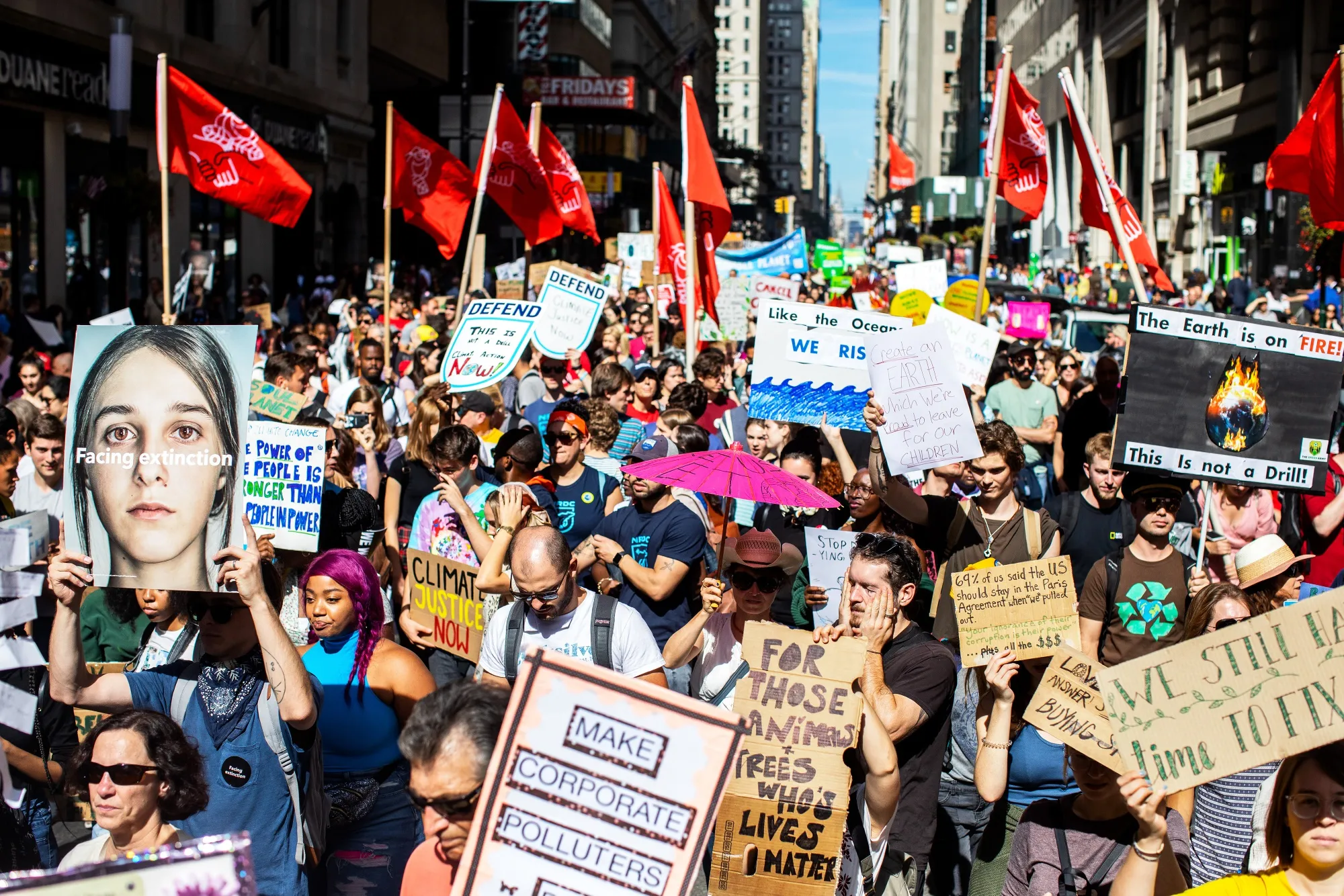 Protesters hold signs during the Global Climate Strike demonstration in New York on Sept. 20.