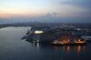 A ship sits docked in front of Nihon Silo Co. grain silo at dusk in Chiba, Japan, on Saturday, Aug. 15, 2020. Japan’s economy shrank last quarter by the most in data going back to 1955 as shoppers stayed home and factory production lines were idled amid a virus-triggered state of emergency and lockdowns in the country’s major export markets.