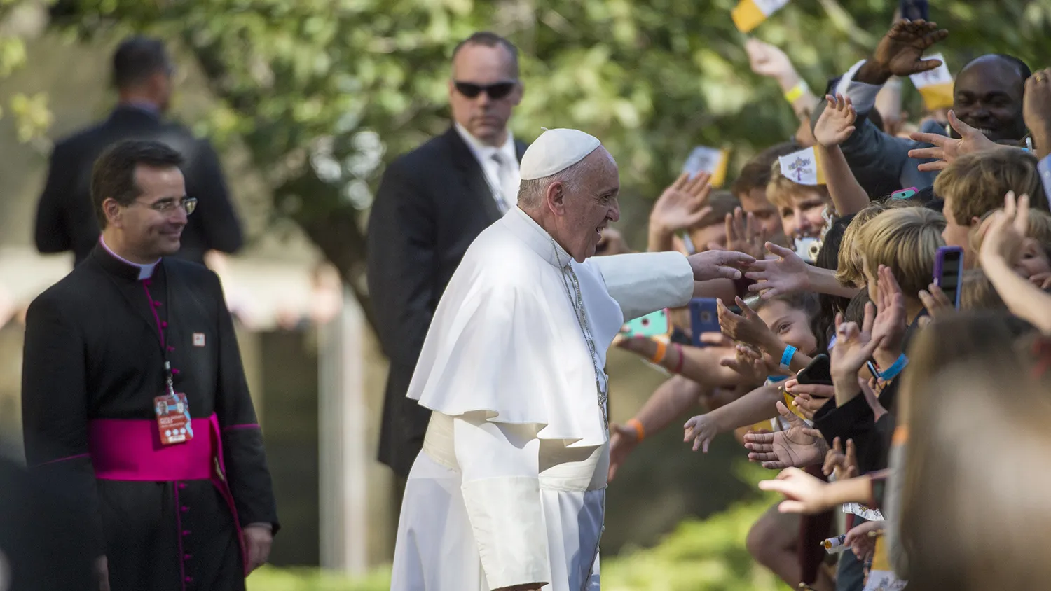 Pope Francis greets well-wishers as he leaves the Apostolic Nunciature to the United States to go to the Basilica of the National Shrine of the Immaculate Conception on Sept. 23, 2015, in Washington.
