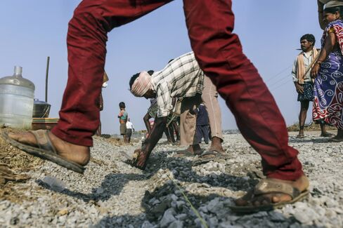 Workers constructing a road