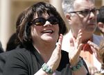 Singer and activist Linda Ronstadt, an Arizona resident, applauds a speaker as she attends a news conference at the Arizona Capitol, Thursday, April 29, 2010, in Phoenix. The Tucson Music Hall will be renamed in honor of Ronstadt, a southern Arizona native who went on to become a Grammy-winning superstar. Mayor Regina Romero announced the change on Friday, March 18, 2022. Ronstadt was one of the top performers of the 1970s and a popular singer well into the 21st century. (AP Photo/Ross D. Franklin, File)