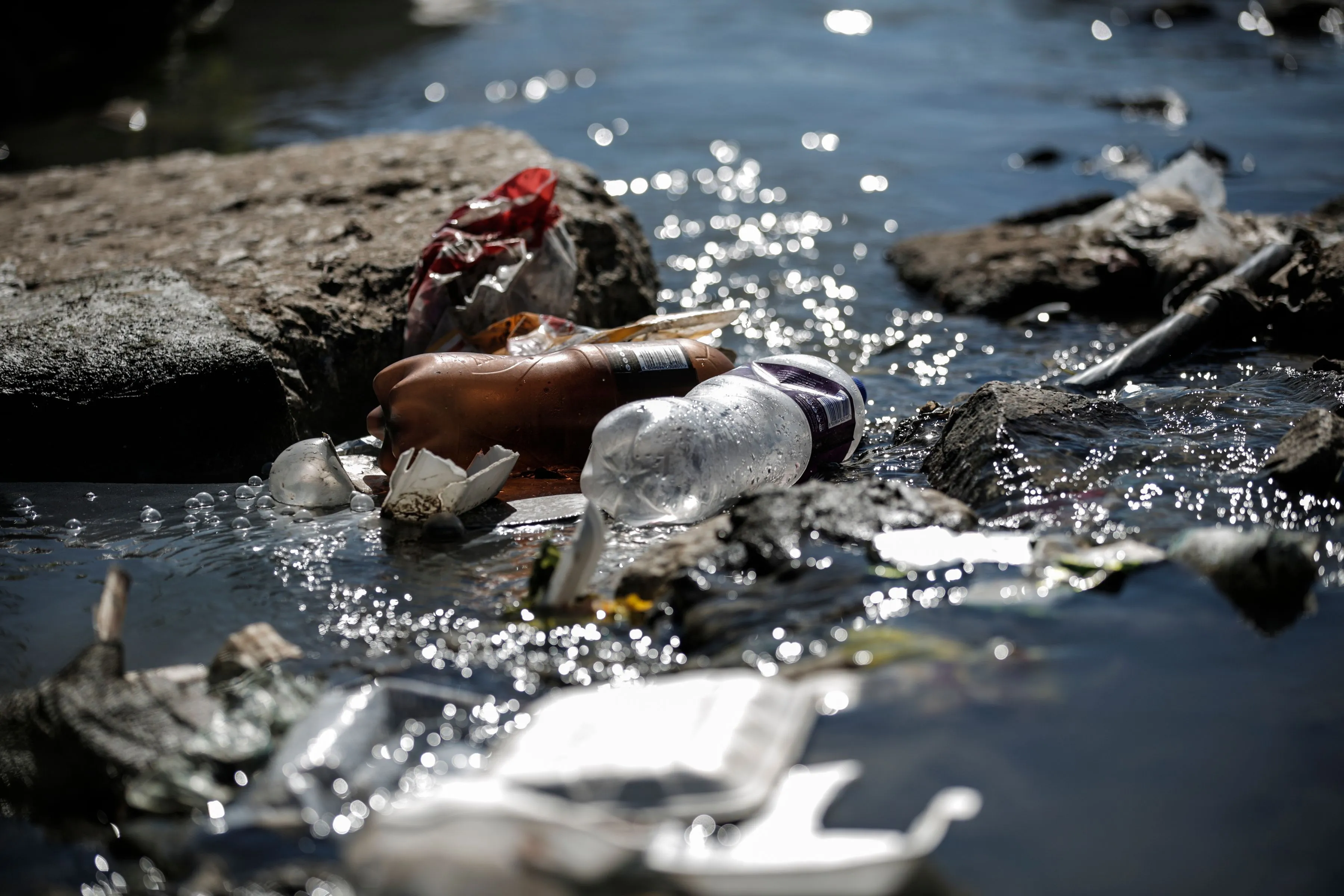 Waste litters the Jukskei as it runs through the Alexandra Township, a few miles from its source. 