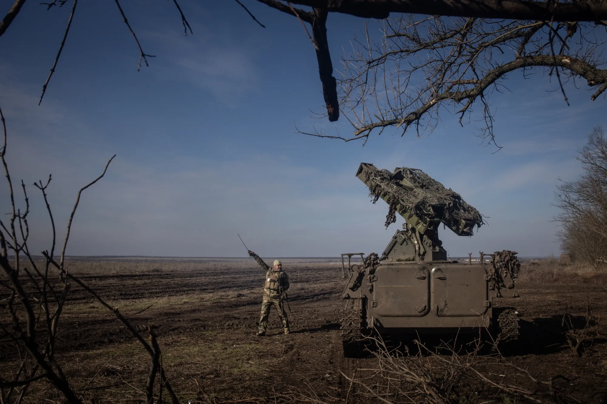 A member of Ukraine's Anti-air unit points to the direction of a Russian reconnaissance drone&nbsp;near Marinka, Ukraine.&nbsp;