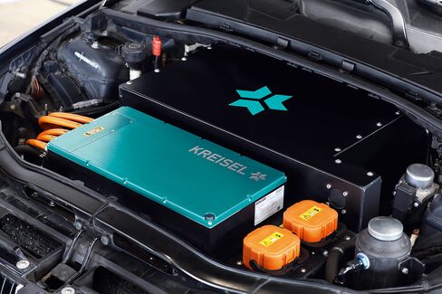A Kreisel hybrid electric motor sits inside a BMW 3 Series engine compartment.