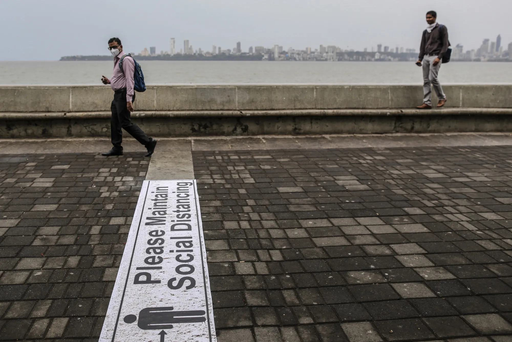 A social distancing sign at a near-empty Marine Drive during a lockdown in Mumbai, India, on June 1.