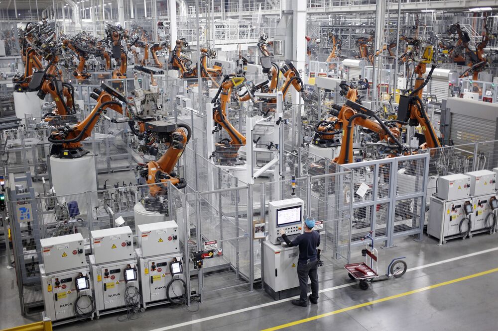 Robots weld car body components for vehicles at an assembly plant in Greer, South Carolina.