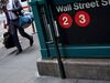 A pedestrian walks past the Wall Street subway station near New York Stock Exchange.