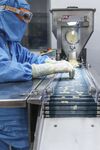 An employee inspects tablets as they move along the production line at the Lupin Ltd. pharmaceutical plant in Salcette, Goa, India, on Friday, Feb. 7, 2014. Lupin, founded by billionaire Desh Bandhu Gupta, expects to gain share in the U.S. amid increased regulatory oversight and curbs on competitors including Ranbaxy Laboratories Ltd.