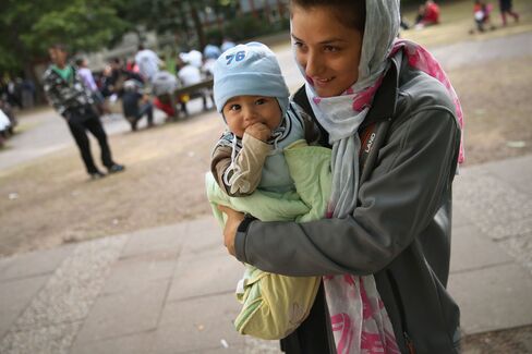 Migrants Seeking Asylum Arrive In Berlin
