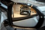 A Nio Inc. ES8 electric sport utility vehicle&nbsp;is reflected in a rear mirror at the automaker's dealership in Shanghai.